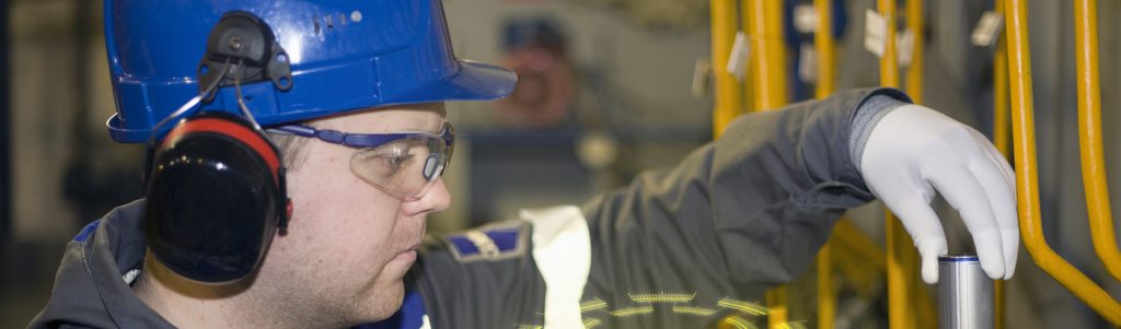 Engineer conducts an on-site fluid analysis at an industrial plant
