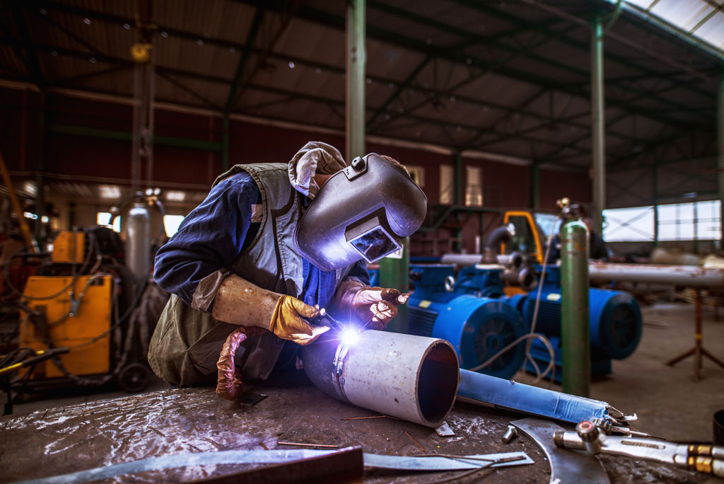 NLOFT employee welding pipe